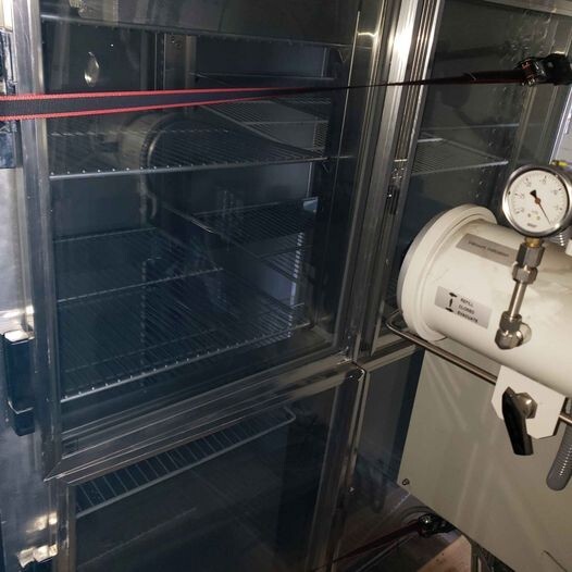Delfiend refrigerator Glass on one side and stainless on the other pass thru
