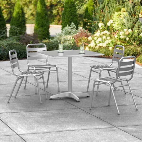 31 1/2» Square Chrome Metal Restaurant Table with 4 Slat Back Armless Chairs