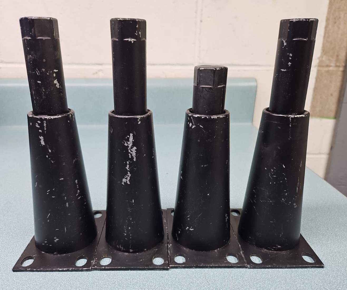 Black metal adjustable equipment legs with attachment plate. 6″-7.5″ (4)