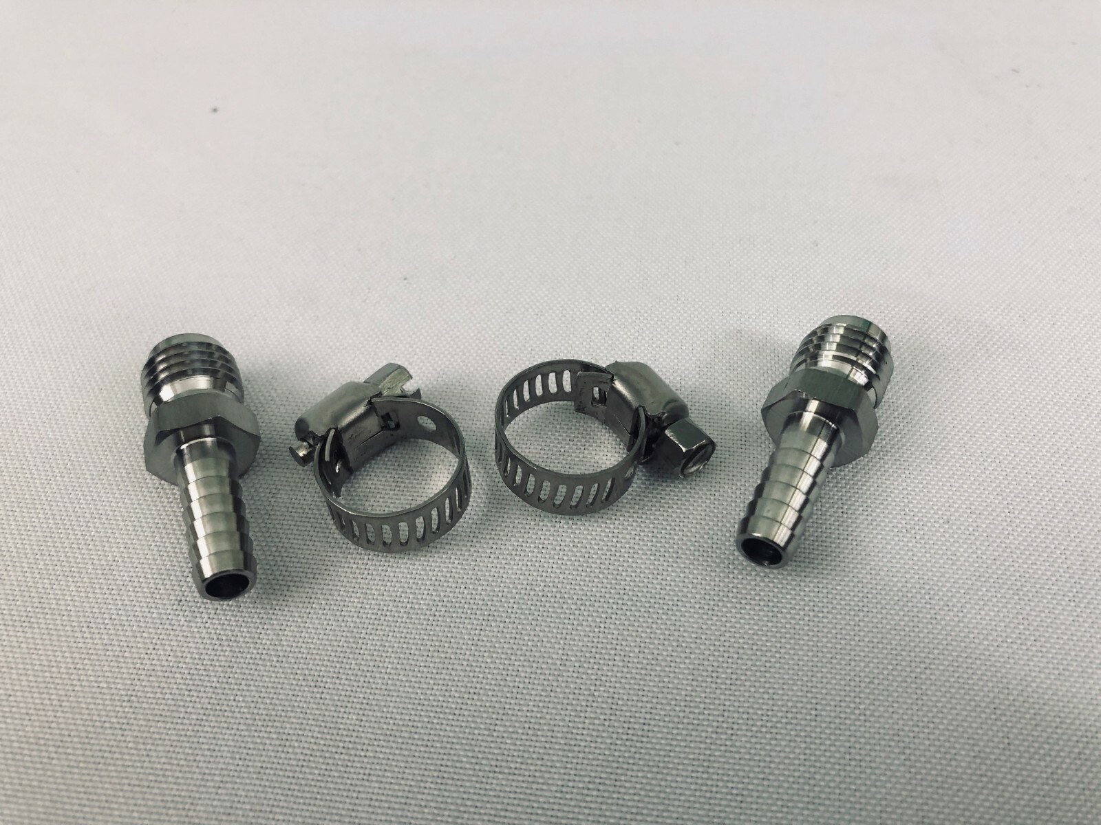 2 Cold Plate Fittings 3/8″ barbed (2 Clamps Included)