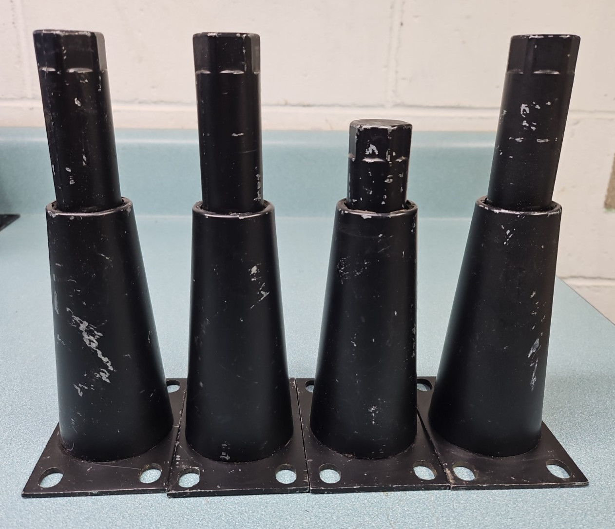 Black metal adjustable equipment legs with attachment plate. 6″-7.5″ (4)