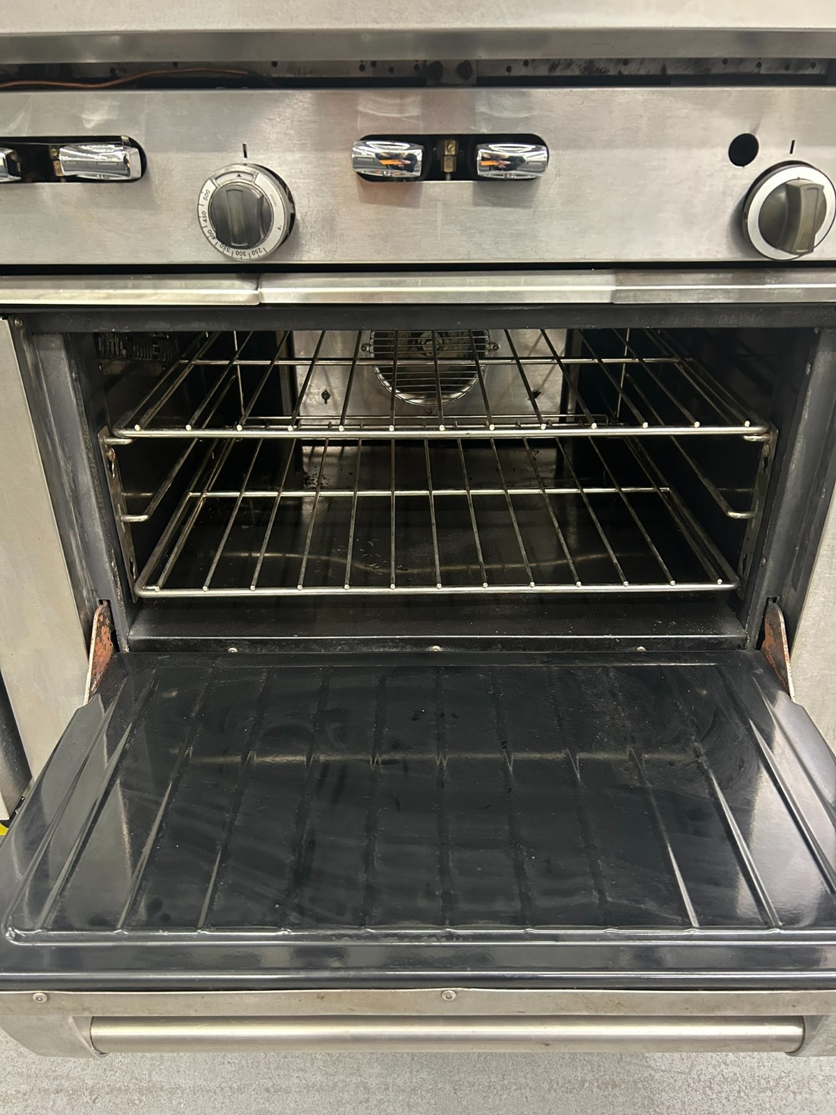 Garland 4 burner and 12″ griddle w/ Convection Oven