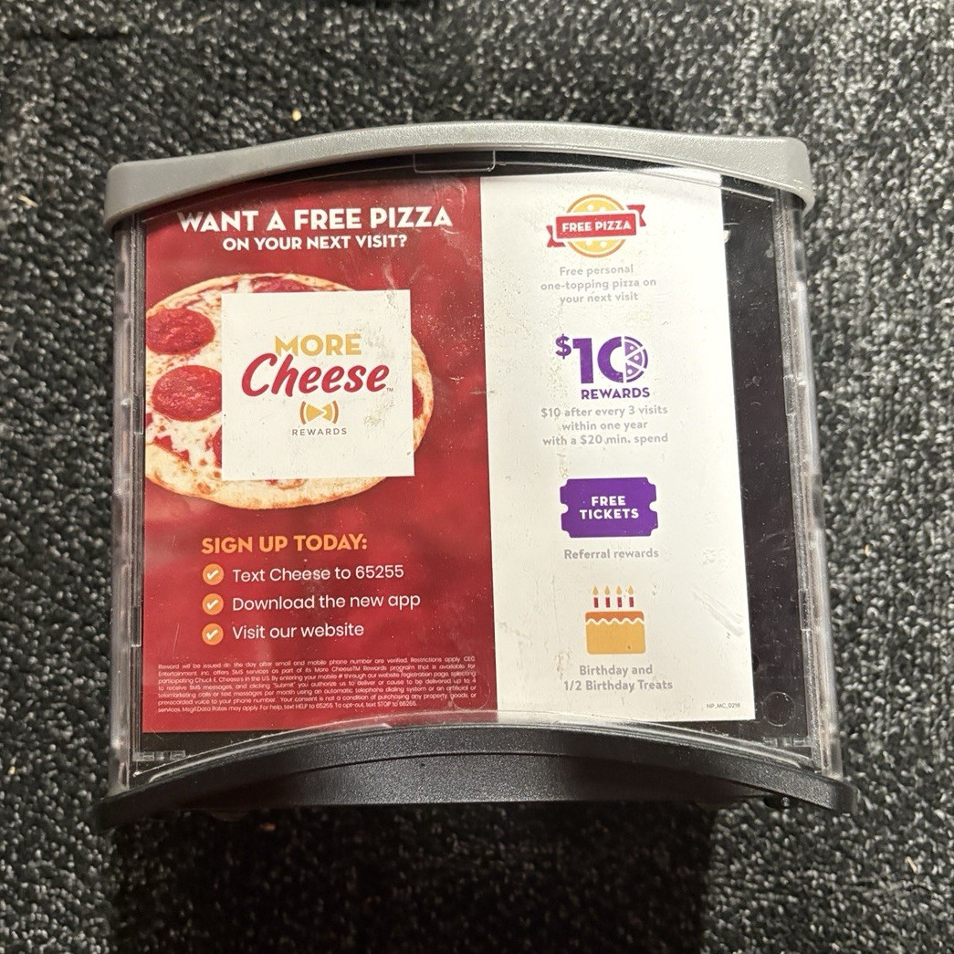 Original Chuck E. Cheese Napkin Holder with “More Cheese” Advertisements